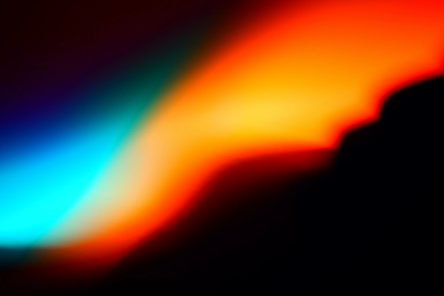 Abstract gradient image with a soft sweep of bright cyan blending into orange and red on a dark background, resembling a glowing light trail or sunset.
