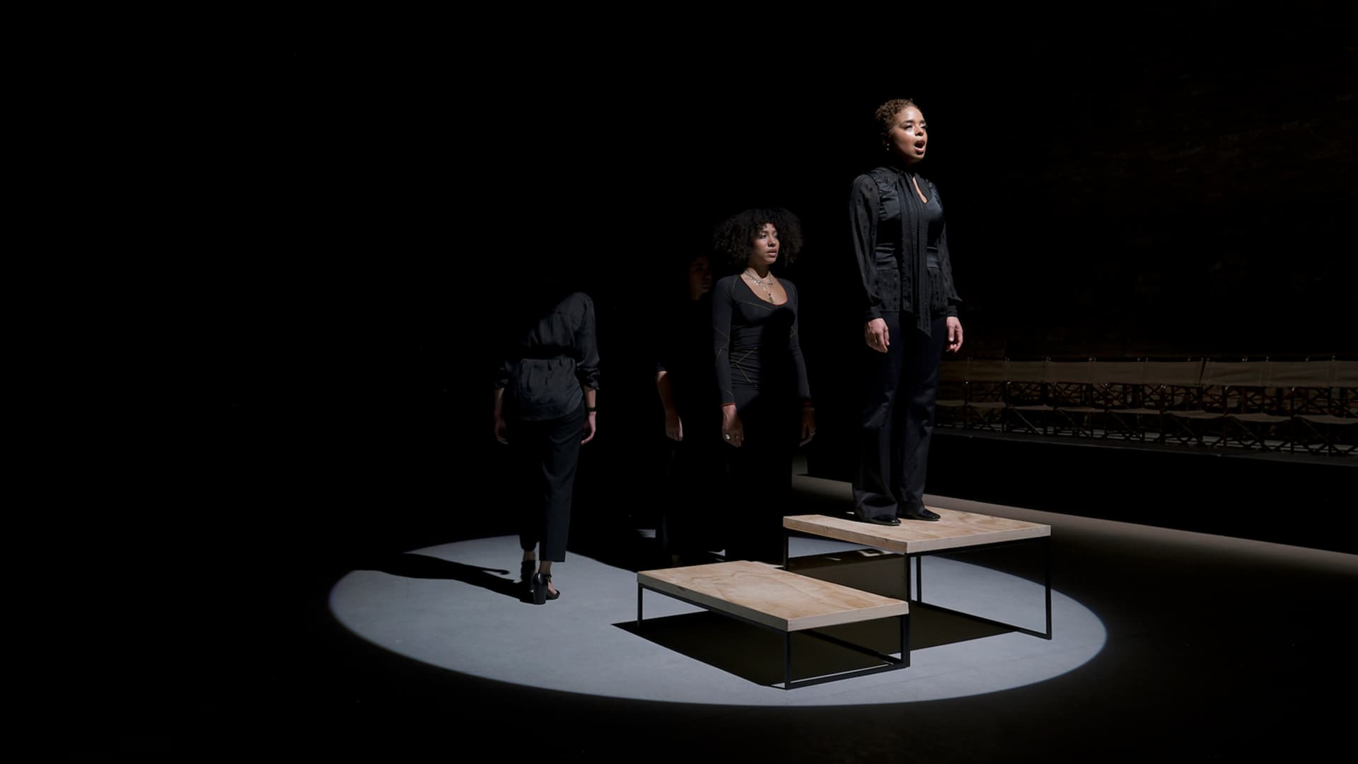 Gabrielle Goliath's Elegy performance with three performers in black at Venice Arsenale 2024