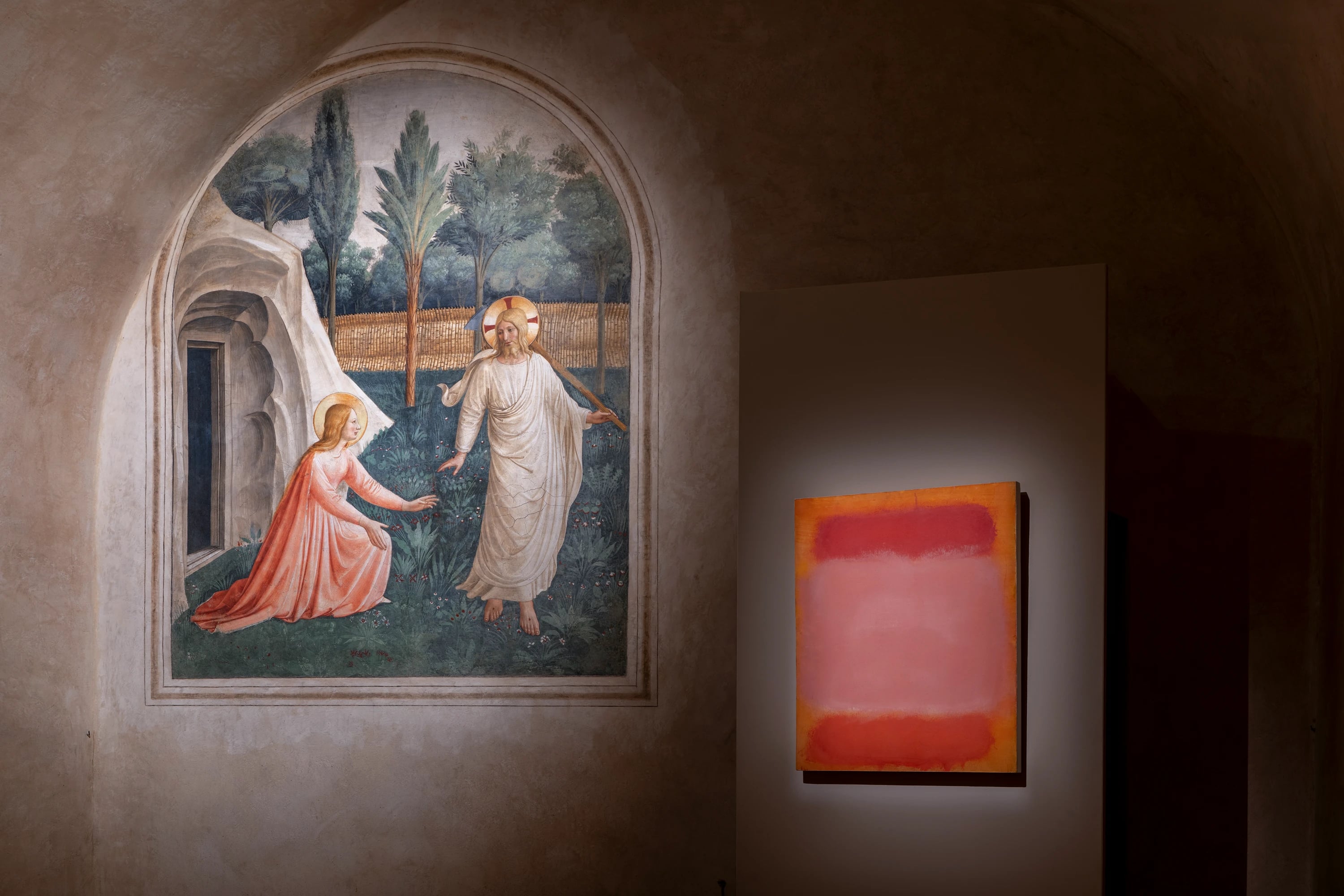 Fra Angelico's Noli Me Tangere fresco displayed alongside a Mark Rothko abstract painting in dimly lit gallery